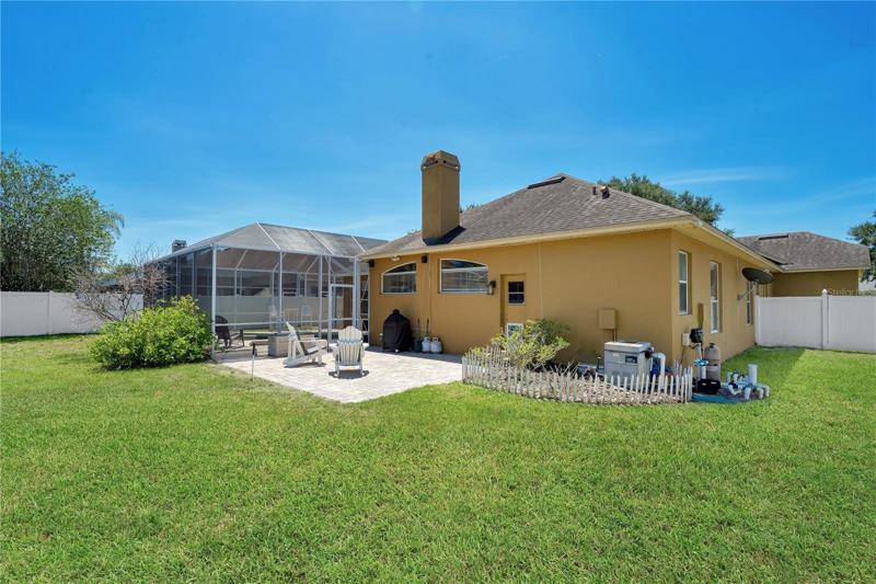 Spacious privately fenced backyard with open brick paver sunning deck. Perfect play area for your children and pets.