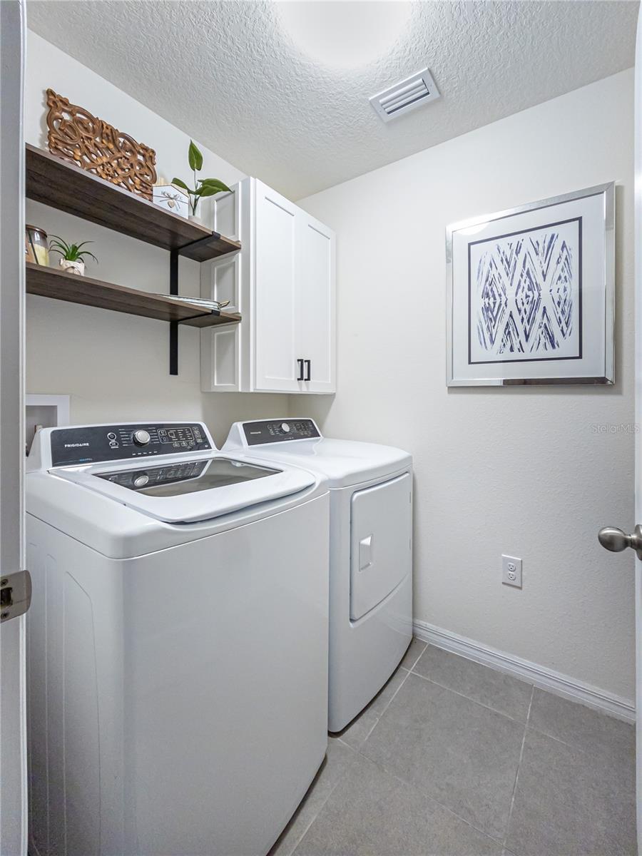 custom shelving and storage in laundry room.