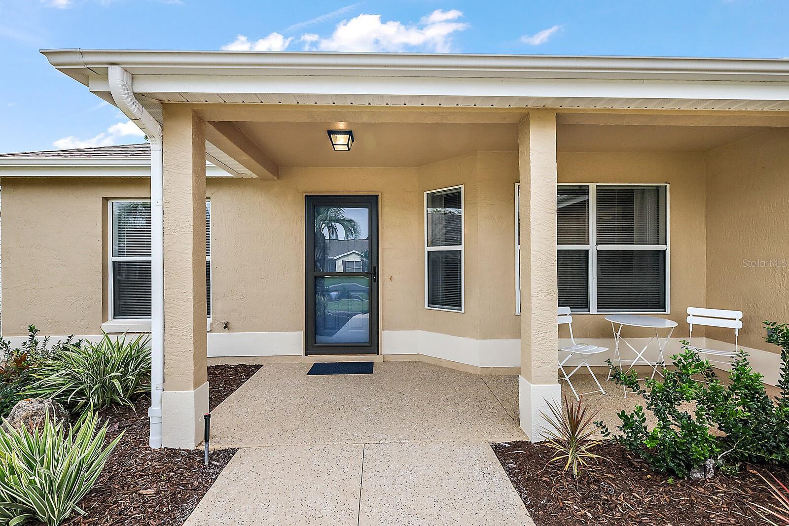Covered front entrance w/storm door