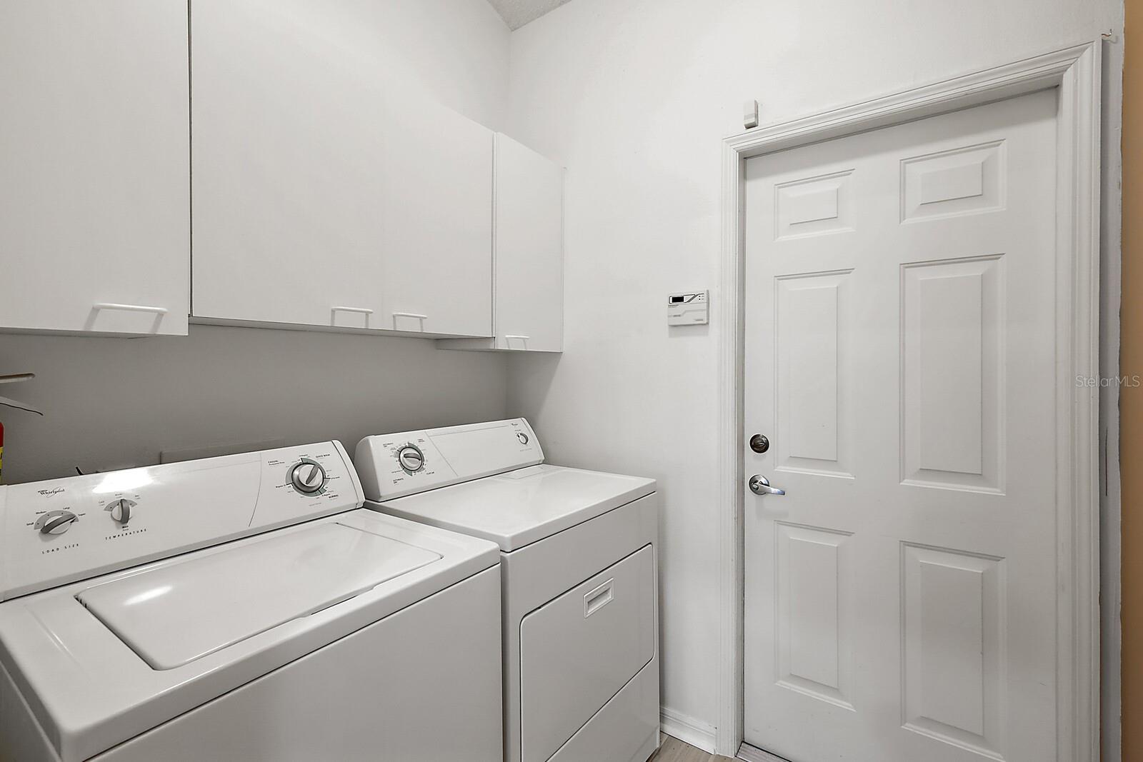 Inside laundry room w/extra cabinets
