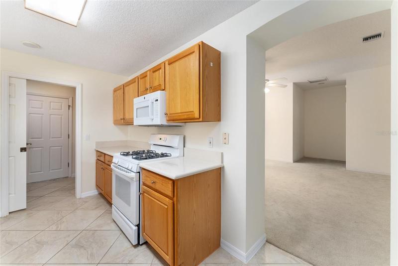 KITCHEN has GAS COOKING! Doorway on R leads to LIVING ROOM.