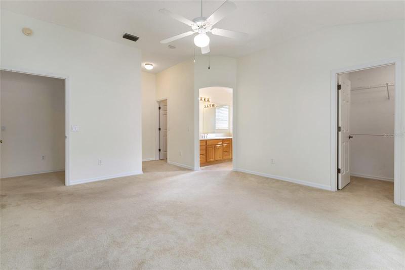 MASTER BEDROOM - From L to R, Doorway leading to Living Room, 2 Closets L of ENSUITE BATHROOM, & 3rd closet on far R