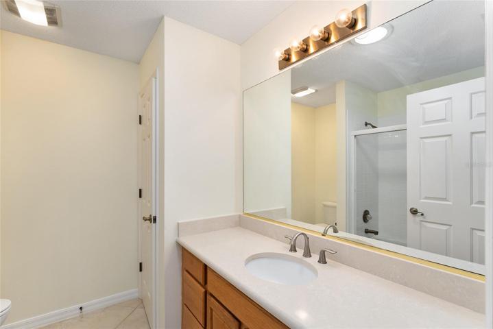 BATHROOM #2 w/ SOLID SURFACE countertops and linen closet