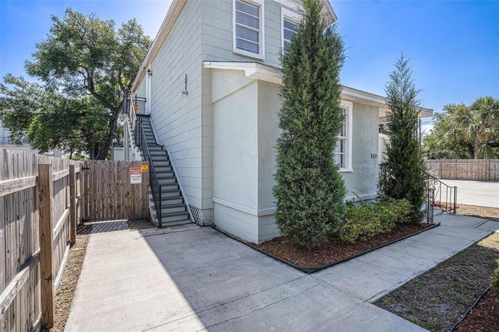 Private driveway and stairway to upper floor unit.