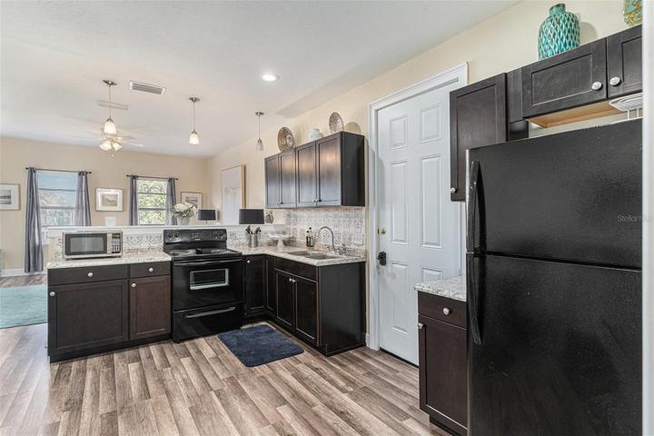 Upper floor kitchen to living room