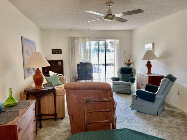 Living room has sliders to porch.
