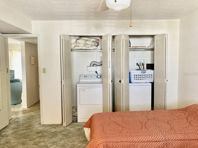 Washer and dryer in second bedroom.