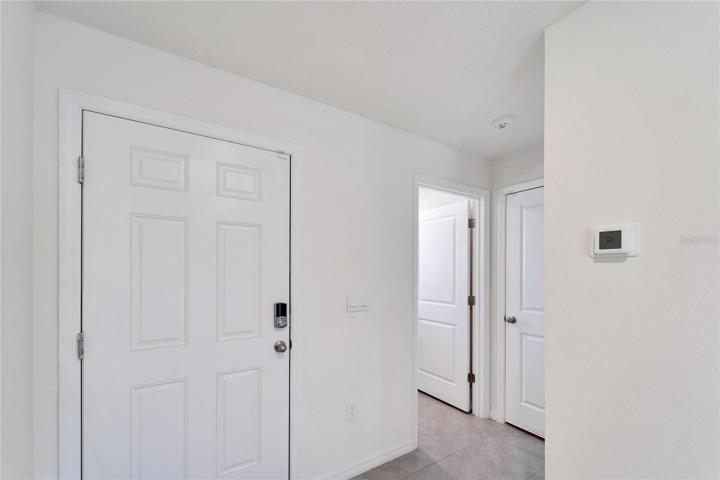 Front Door/ Walk way to Laundry Area and the Garage