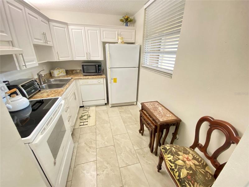 Newer cabinet upgrades and ceramic tile floor