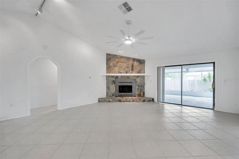 Living room with wood burning fireplace