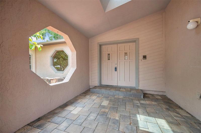 Front door with brick paver walkway