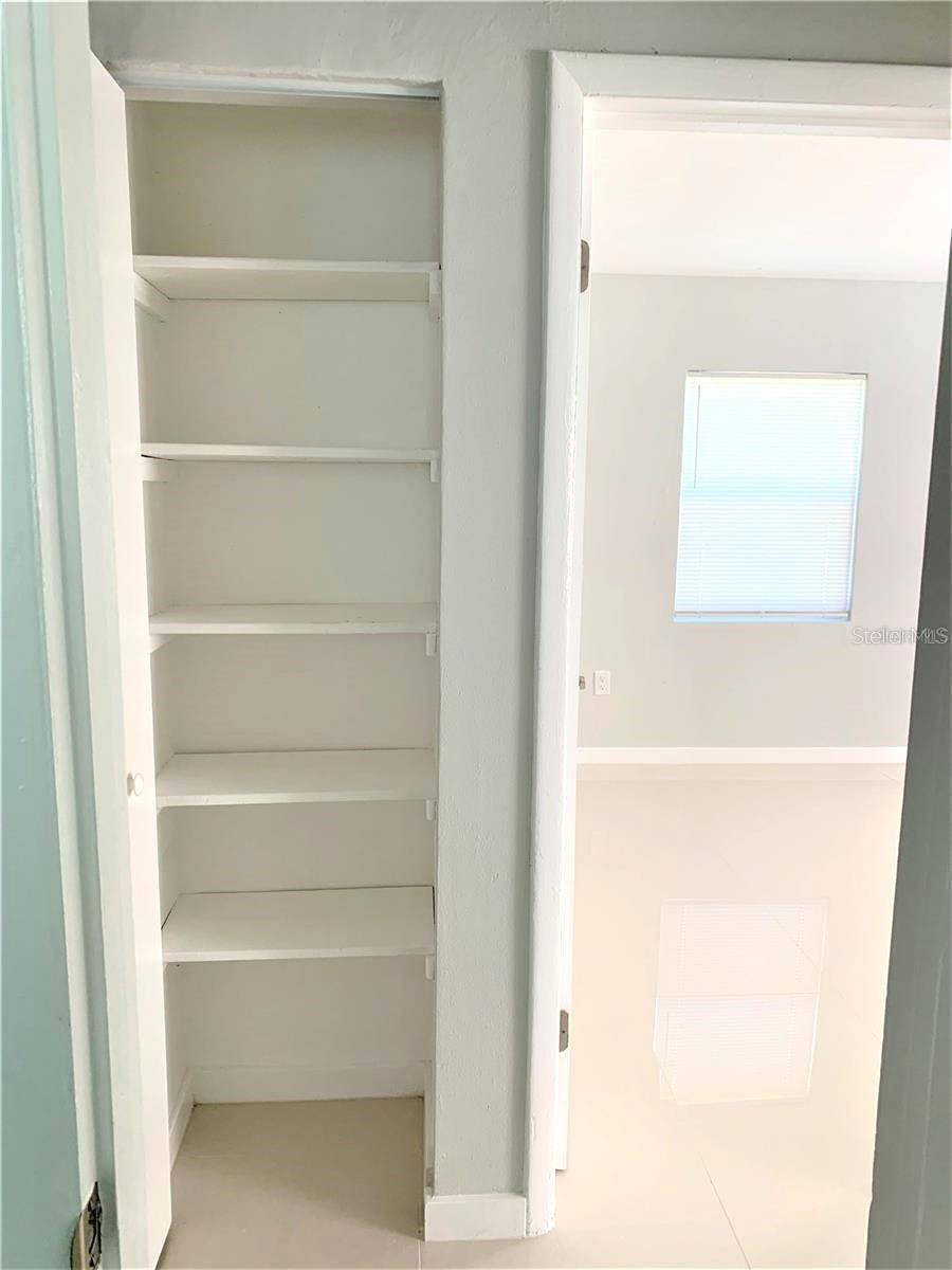 Linen closet next to the bedrooms for extra storage.