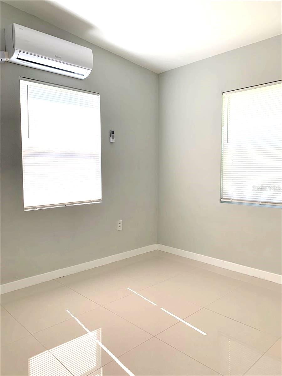 bedroom 2 with new high efficiency mini split AC with remote for ease of use.