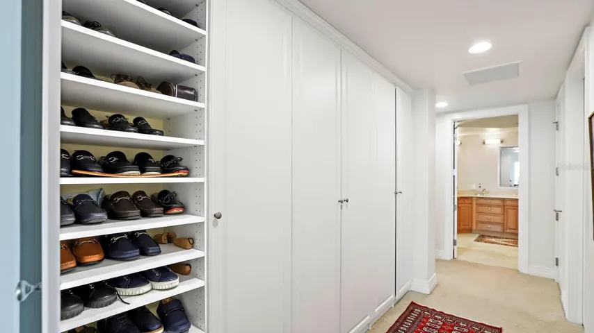 master bedroom built in closet with shelving