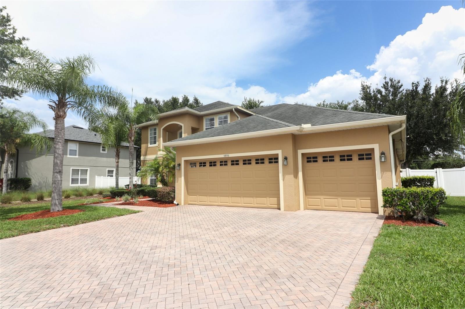 3 Car Garage and Paver Driveway