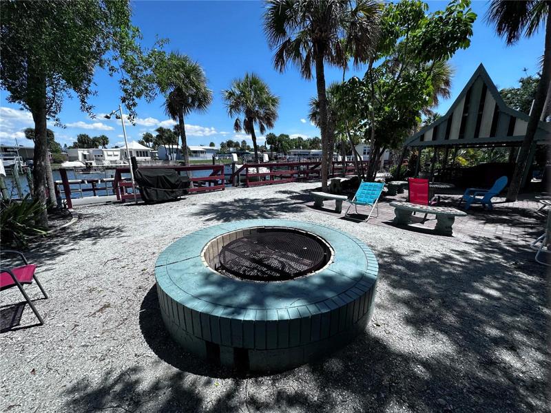 Community water side fire pit and picnic pavilion