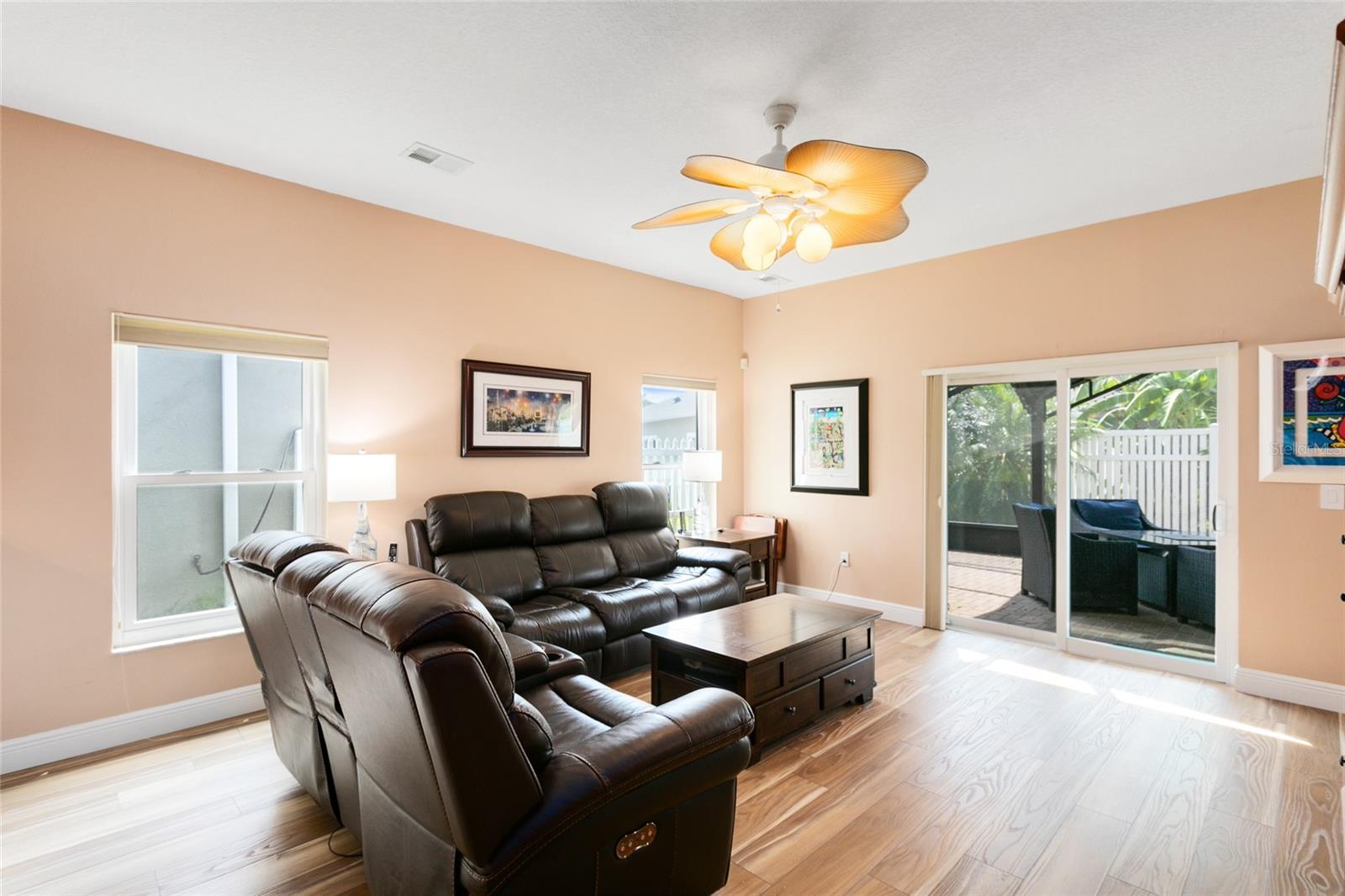 Family room with lots of sunlight and newer high impact Glass Slider door.