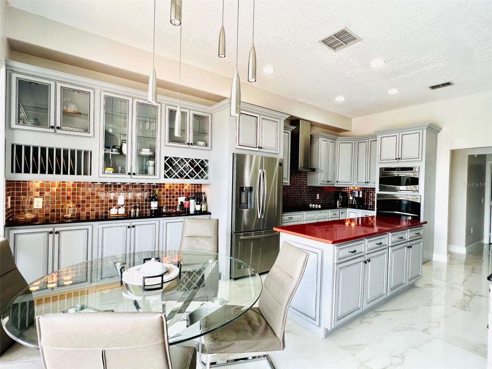 Kitchen w/ eating space overlooking pool