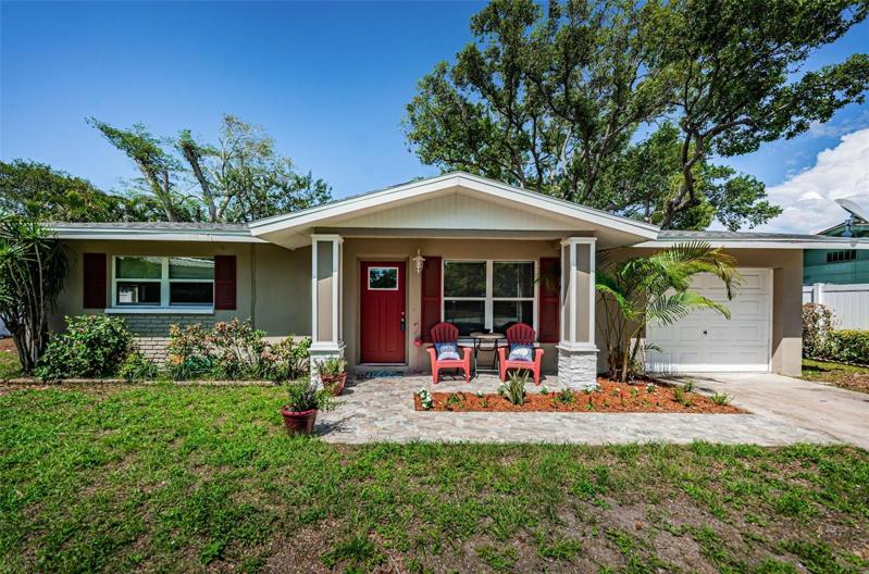 This beautiful three-bedroom house with an inviting front porch welcomes you home as you step inside and begin your next chapter.