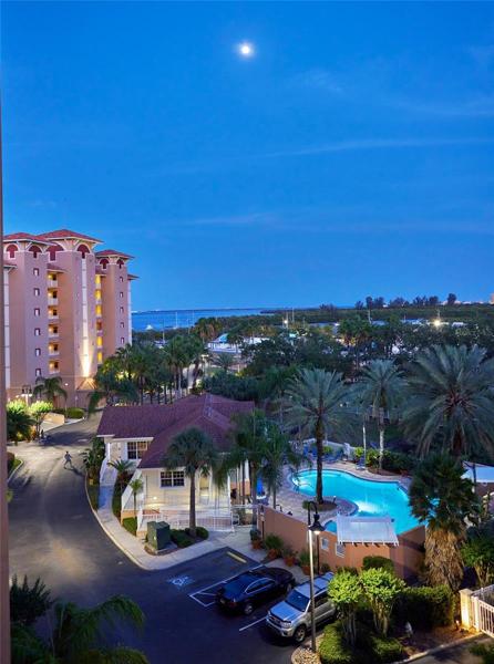 Beautiful shot of the full moon off the entrancee balcony, pool, and more of the Bay.