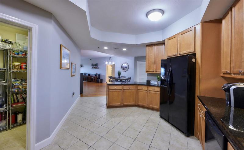 The kitchen with the spacious pantry to the left.