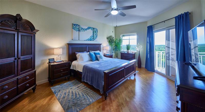 Master bedroom suite leads to the balcony.