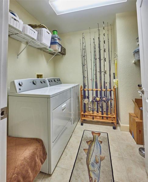 Laundry room with storage space.