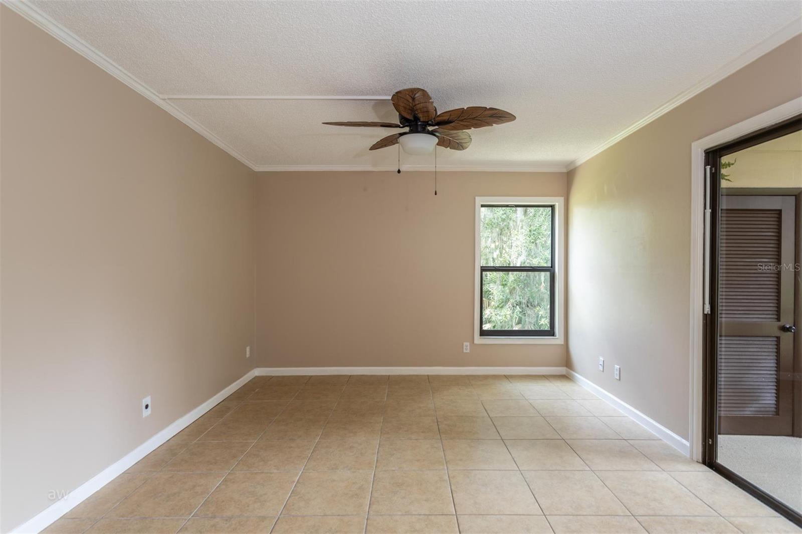 Great room with tile floors, fresh paint, upgraded sliders