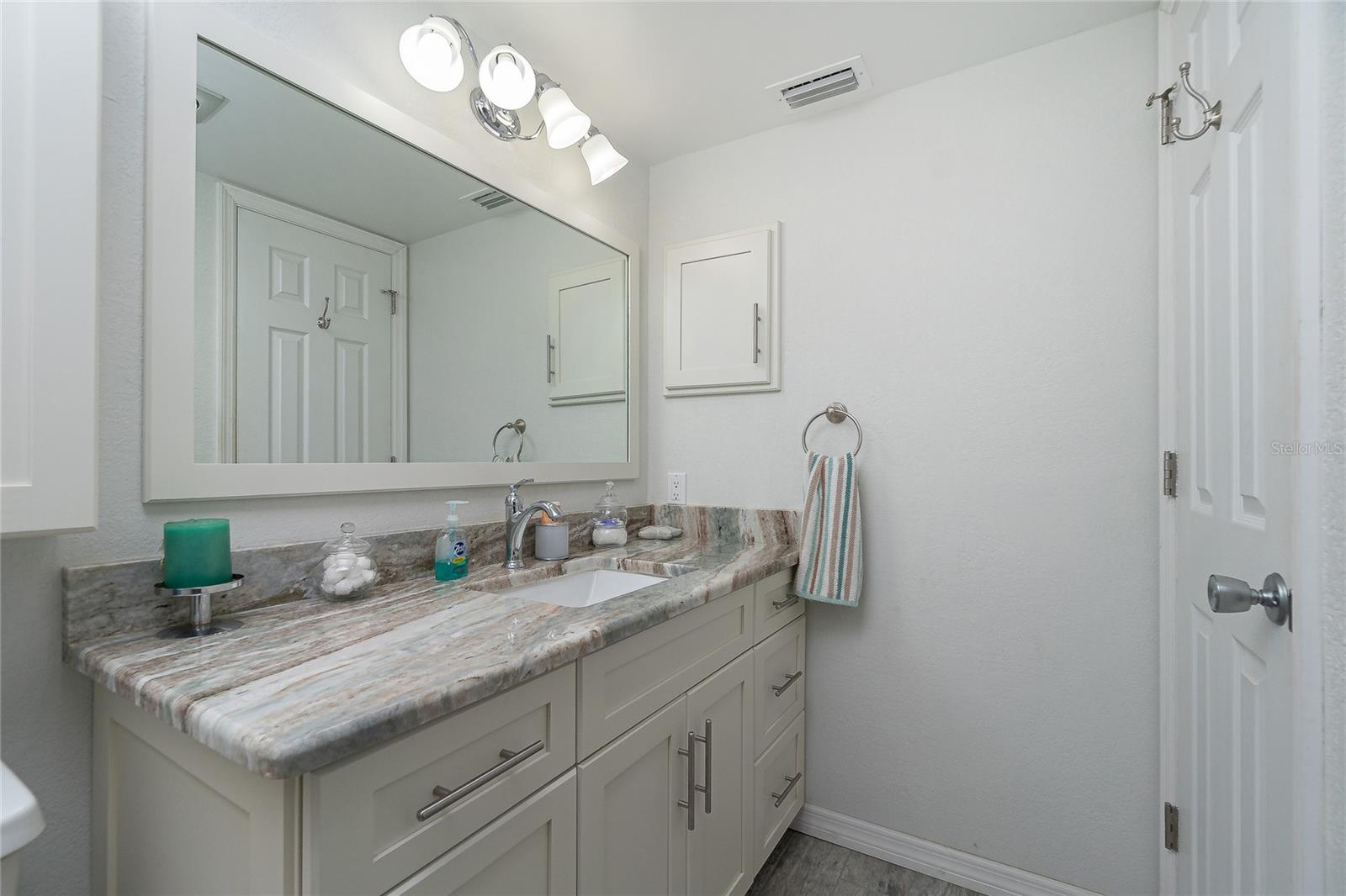 Check out the updated vanity, granite countertop, new mirror and new lighting!