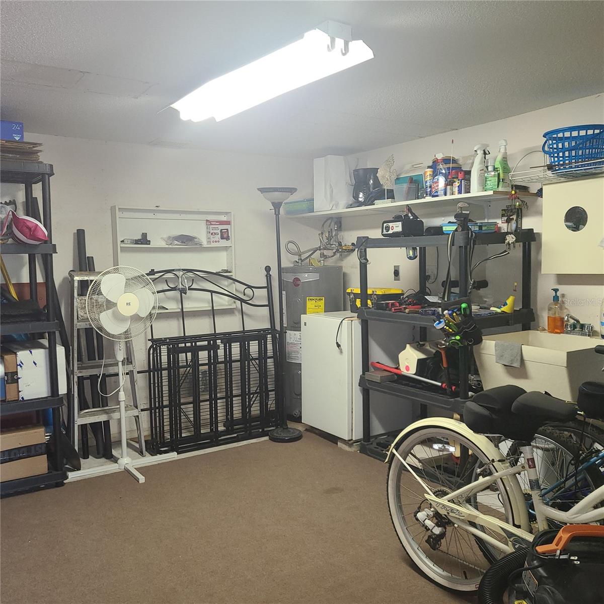 Huge air conditioned (wall unit) storage room behind the carport!  You will NOT find this much storage space in other condos!