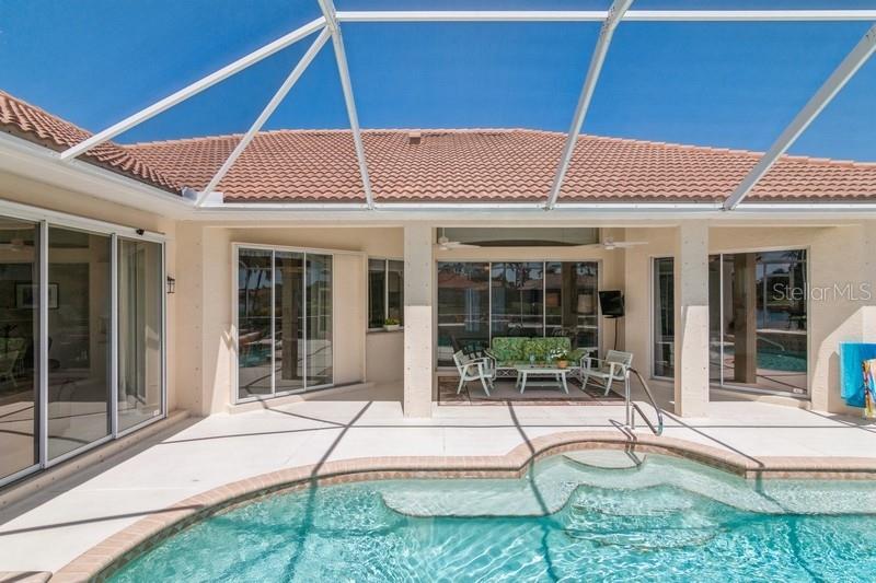 4 sets of sliding glass doors to the pool area
