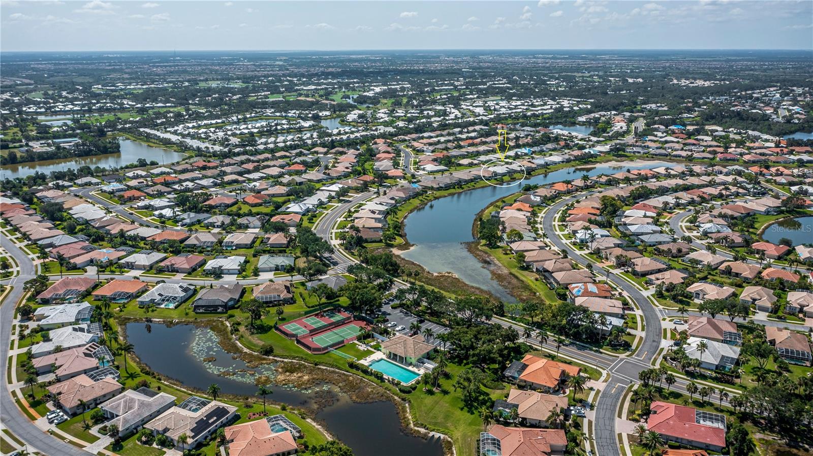 aerial view of clubhouse and subdivision, target on subject property