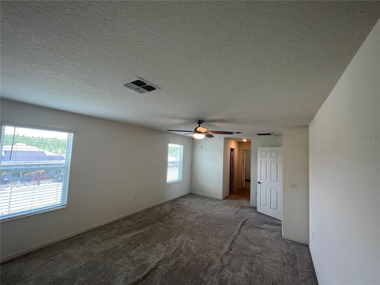 Master bedroom with 2 large walk in closets