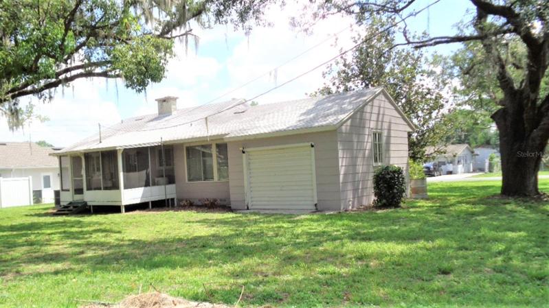 Back yard with garage and screened in porch