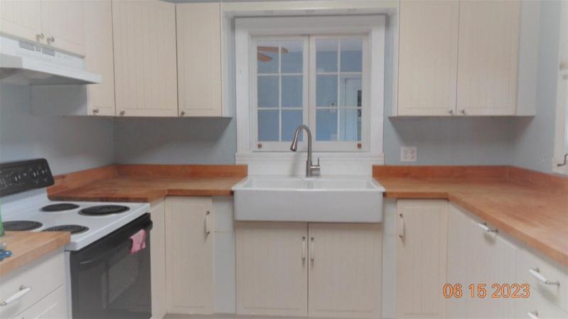 Kitchen with pass-through to dinning room