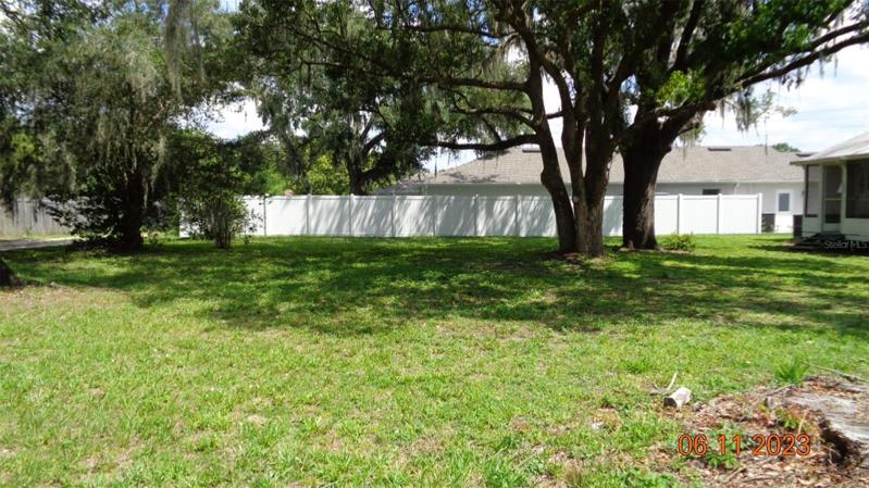 90x140 lot, fenced on one side, corner lot with back alley.
