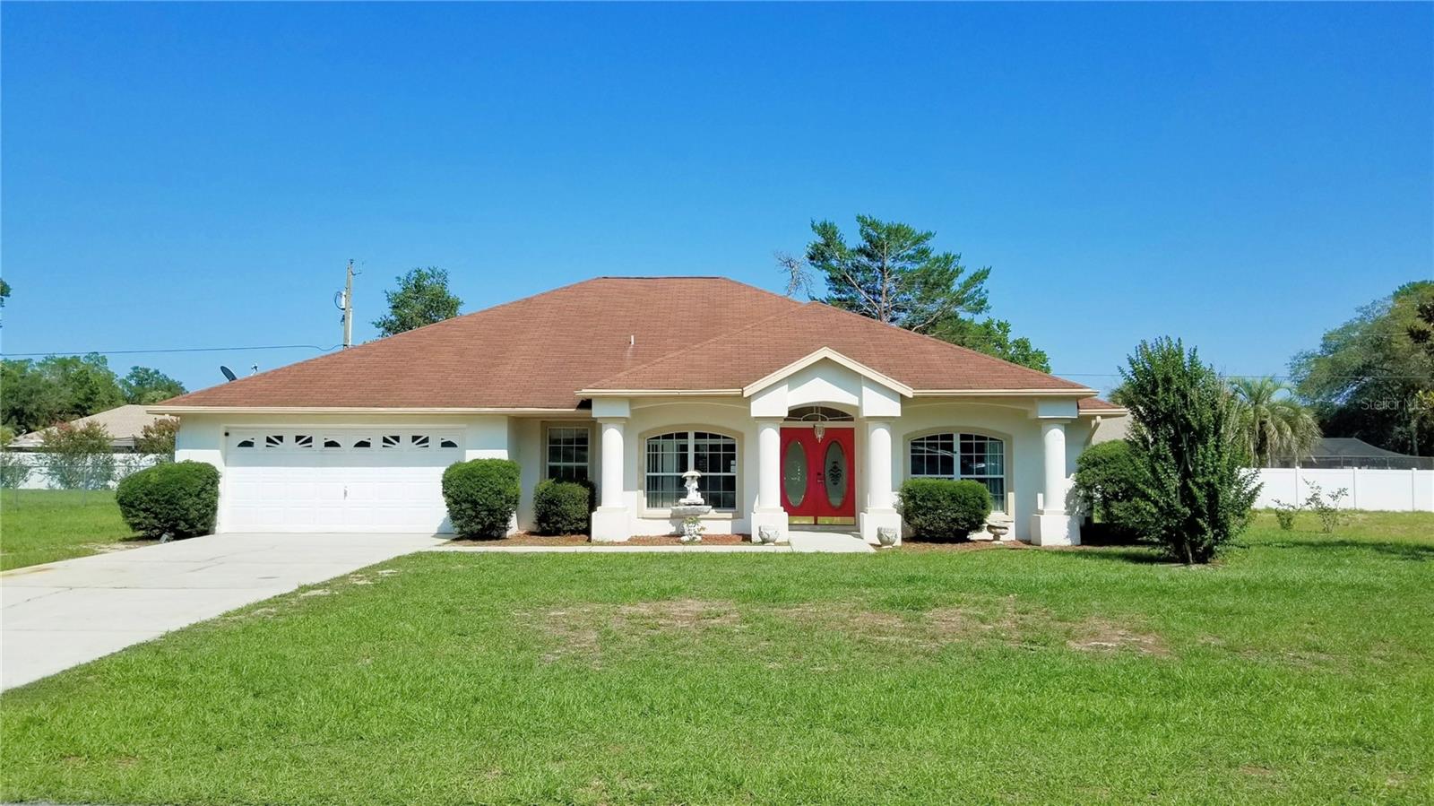 Front of home, faces west