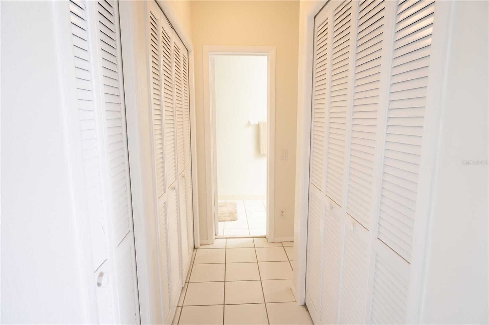 Hallway to the 2nd bedroom and Laundry Room closet