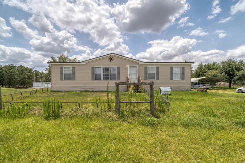 Partially fenced with 3 outbuildings