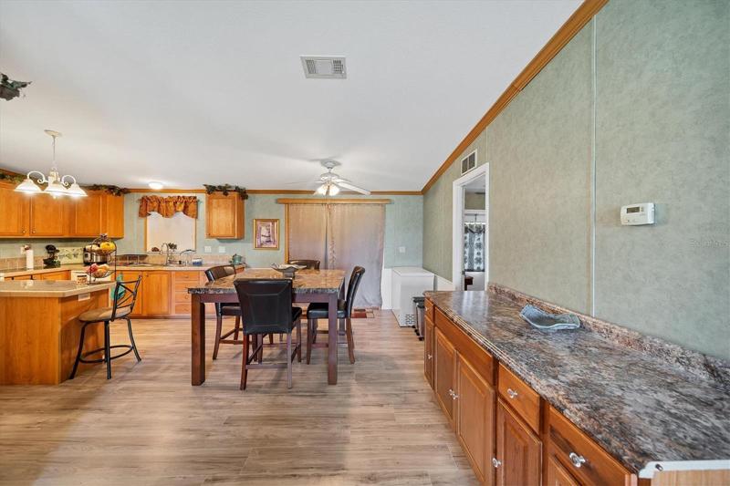 Dining room connects kitchen and living room with a larger open concept feeling.