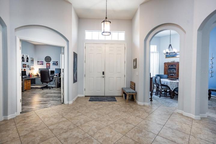 Foyer with views of office and dining room