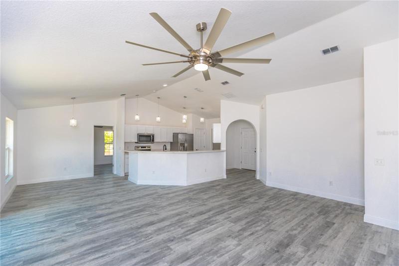 Living room, Dining Room & Kitchen featuring high ceilings.