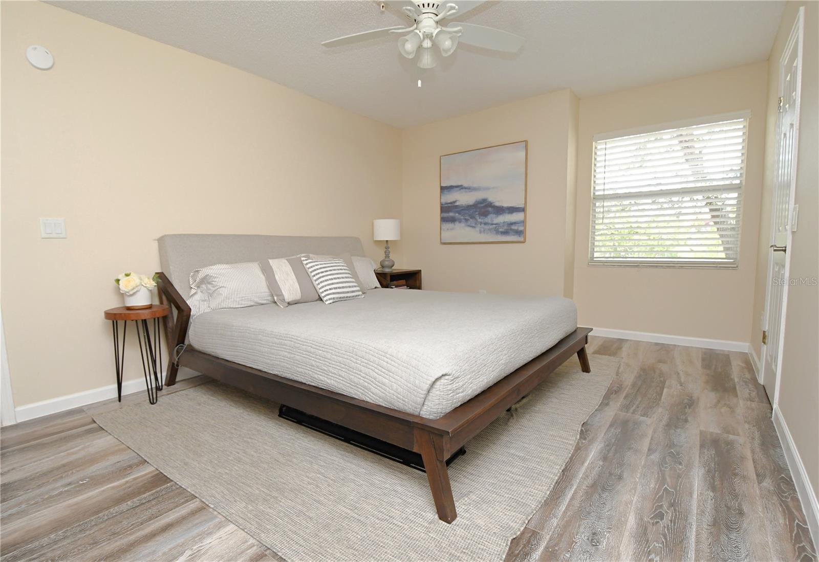 Master bedroom with en-suite bathroom. Luxury vinyl flooring, ceiling fan/light and a large walk-in closet.