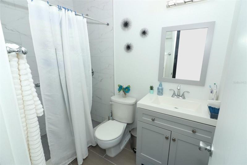 Renovated Bath with white tile
