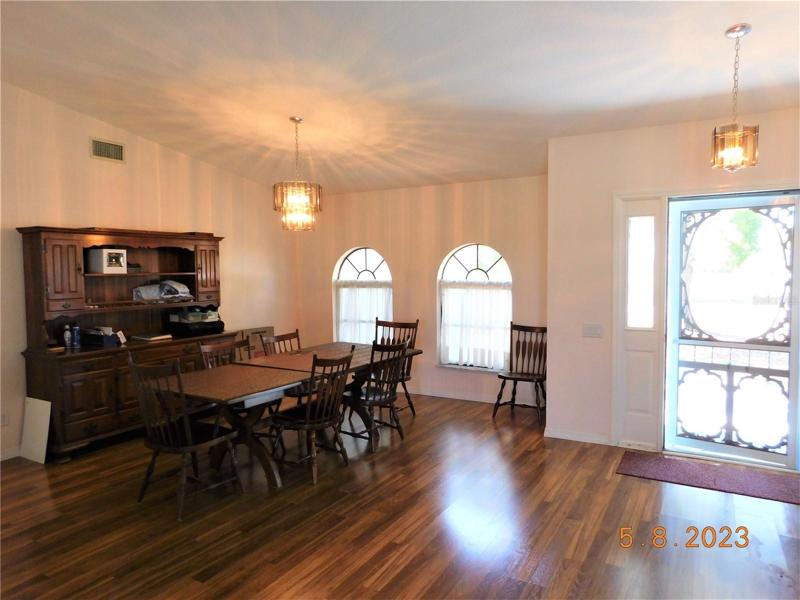 front door opens to the formal dining & living room