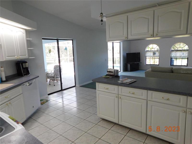 spacious kitchen opens to the lanai and large great room