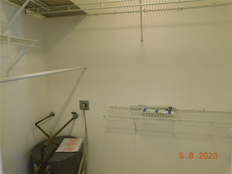 one of two walk-in ensuite closets: TWO hot water heaters!