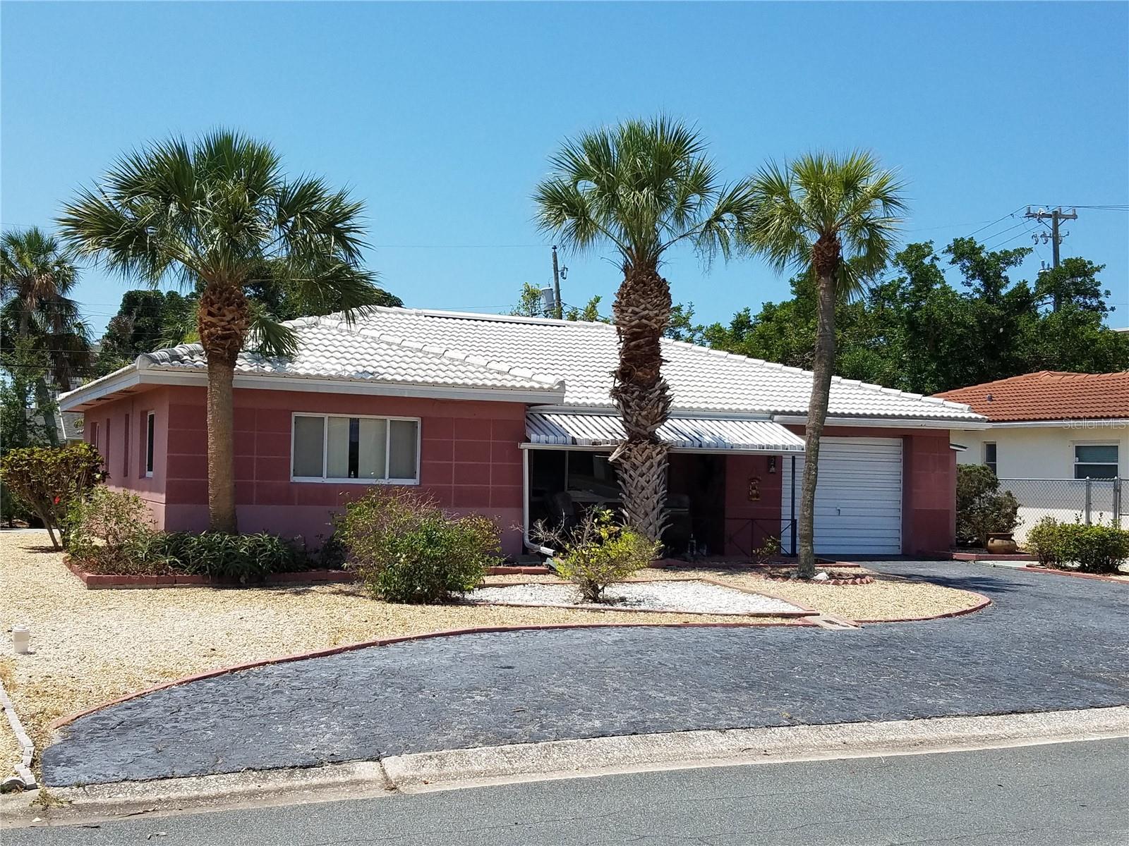 52 45th Ave,  covered front porch, extra large one car garage, St Pete Beach, FL 33706