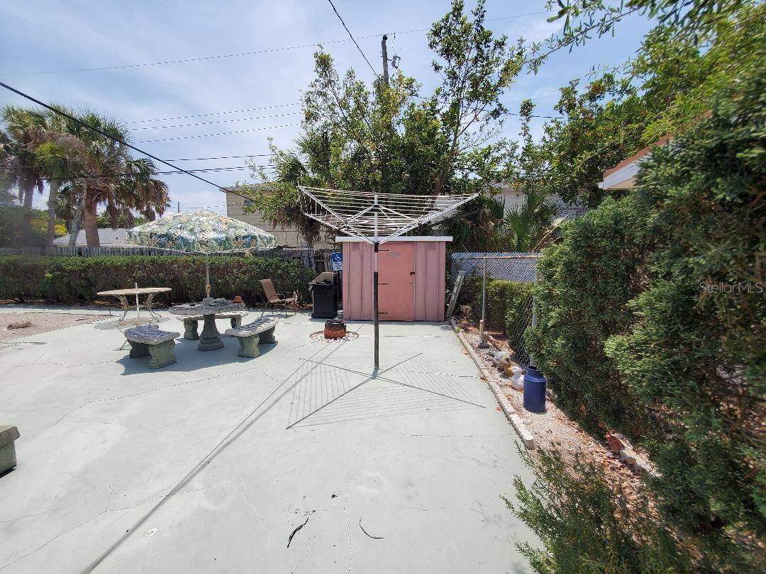 Storage shed and fresh air clothesline.