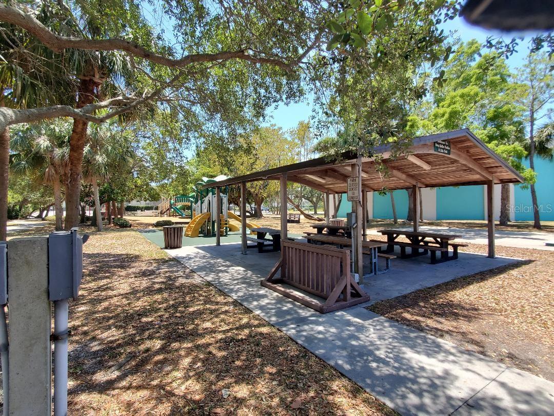 Lido Beach Park, 45th Ave, across street from subject property, children's play equipment and picnic tables open or covered.